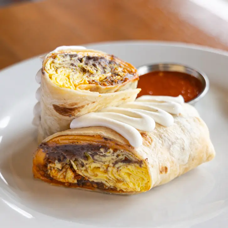 Scrambled eggs, refried beans, chorizo, cheddar cheese, ranchero sauce, sour cream, flour tortilla