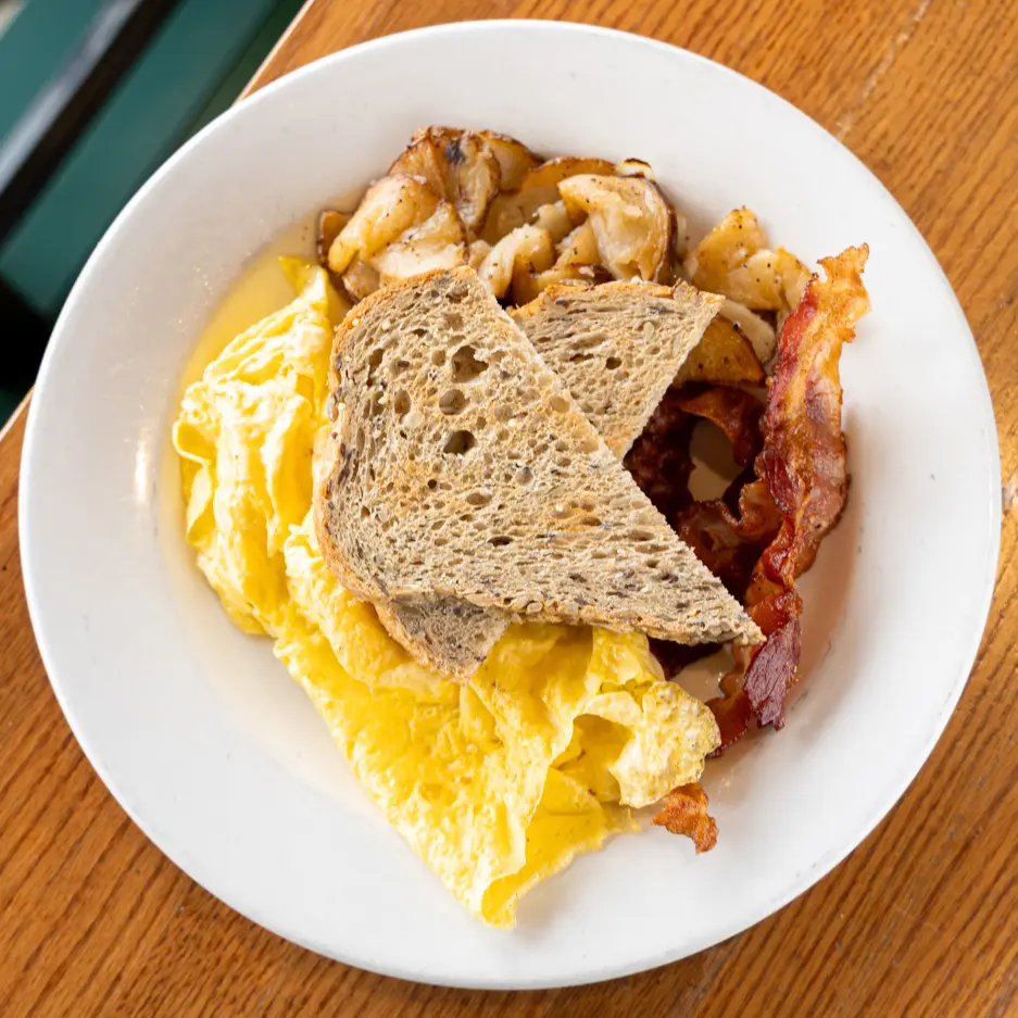 Choice of fire-smoked ham, applewood bacon, sausage, or scrapple, breakfast potatoes, Pullman toast