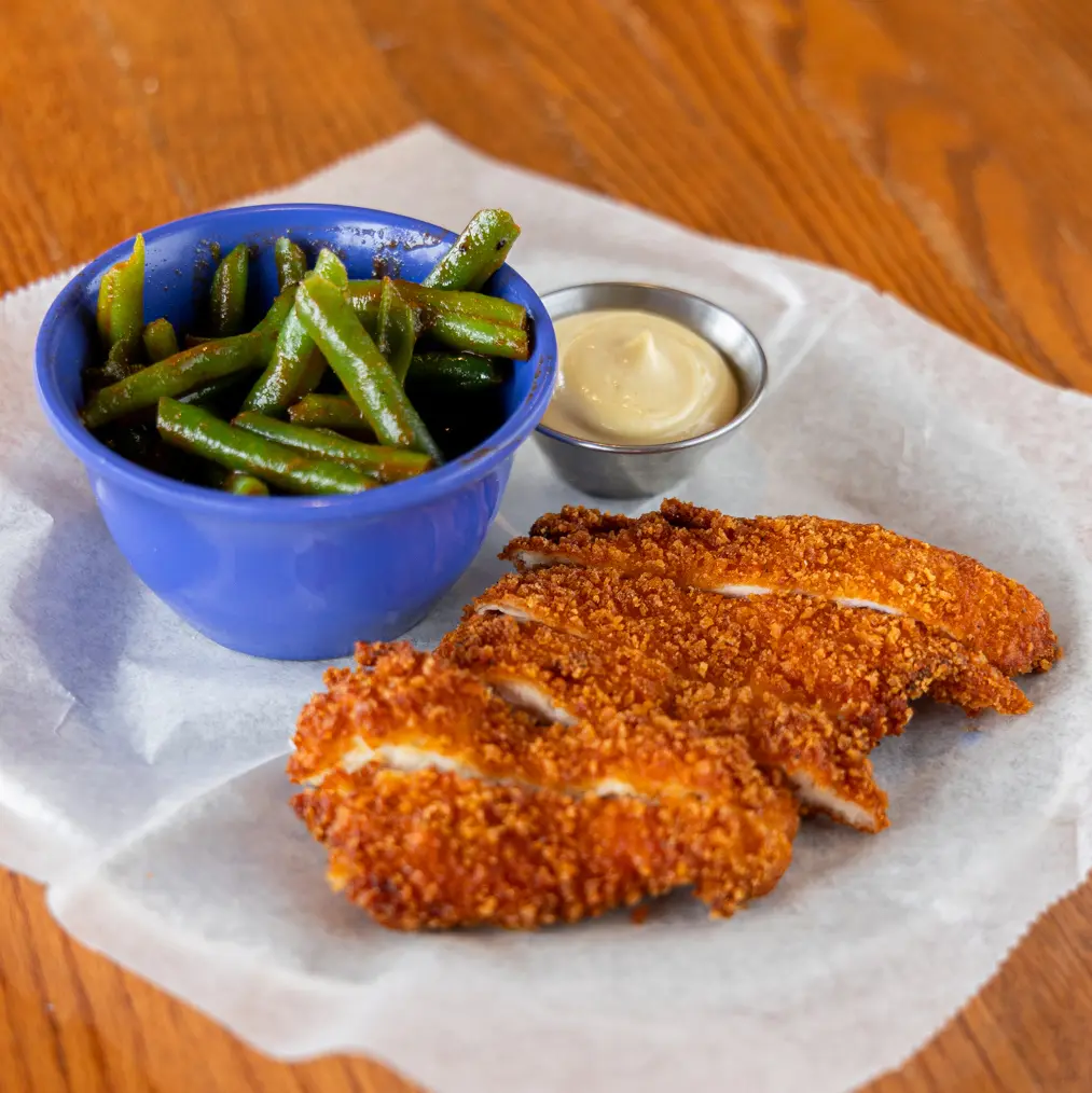 The kids fried chicken sticks and fresh side is featured on our scratch-made menu