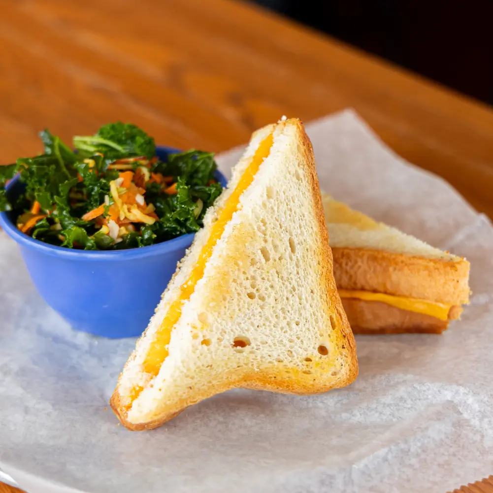 The kids grilled cheese and fresh side is featured on our scratch-made menu